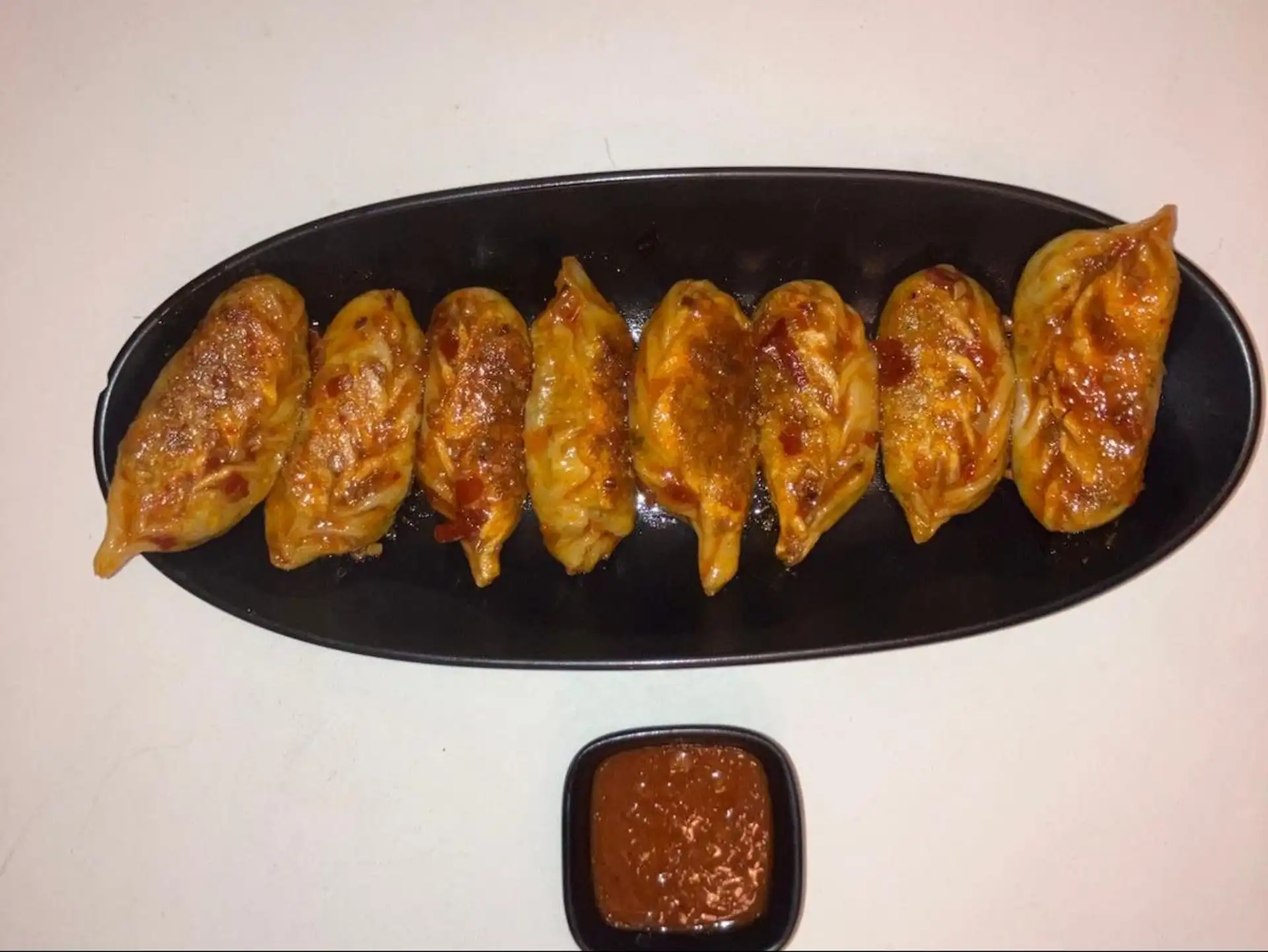 Schezwan Pan Fried Momos