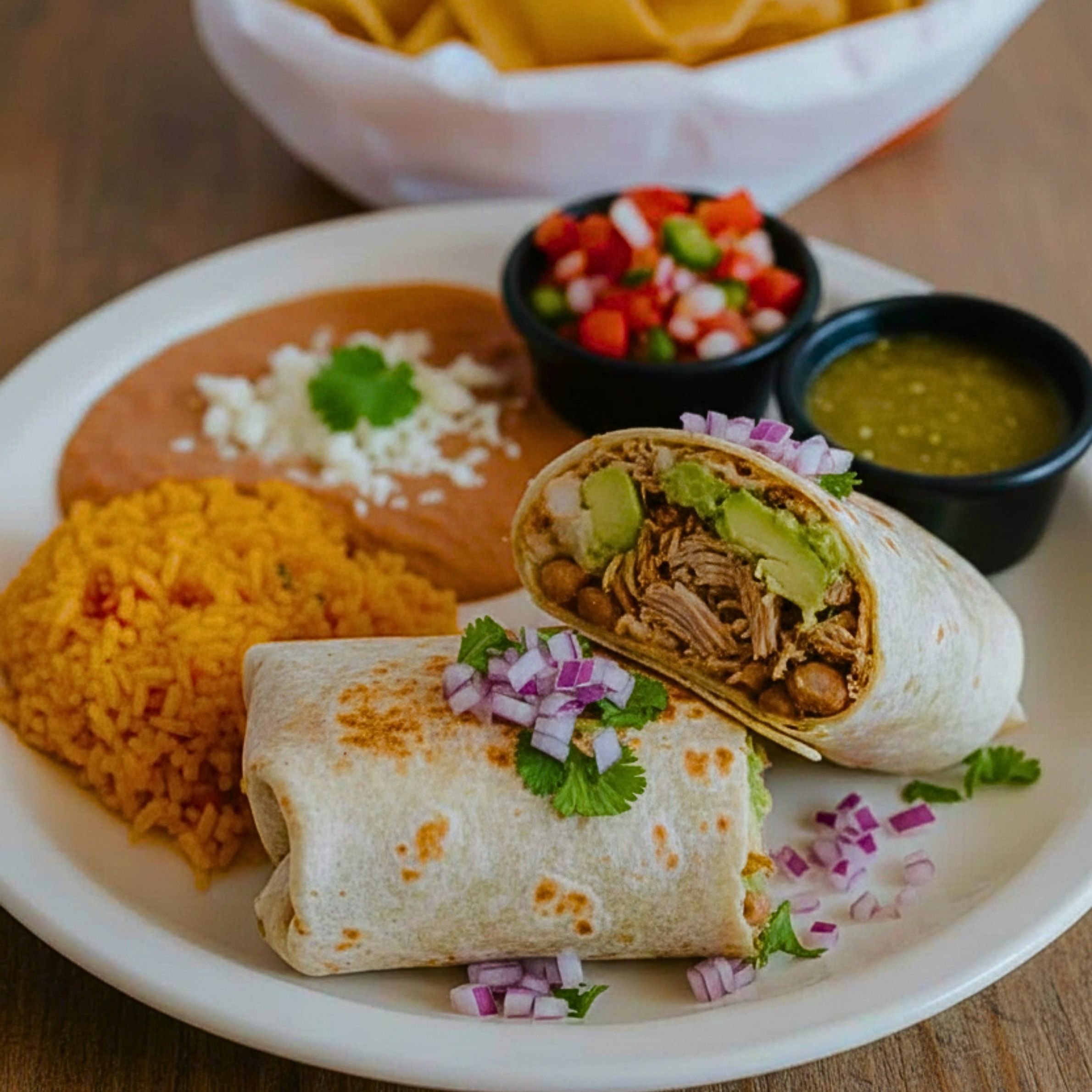 Carnitas Burrito (Served w/ rice, beans, onions, cilantro & green or red salsa)