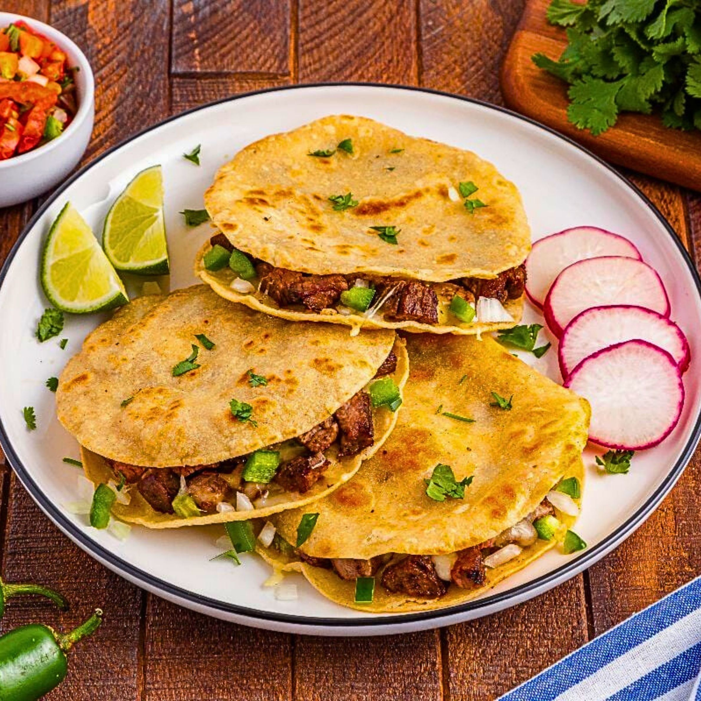 Crispy Quesadilla (Flour tortilla w/ melted cheese served with onions, cilantro & green or red salsas)