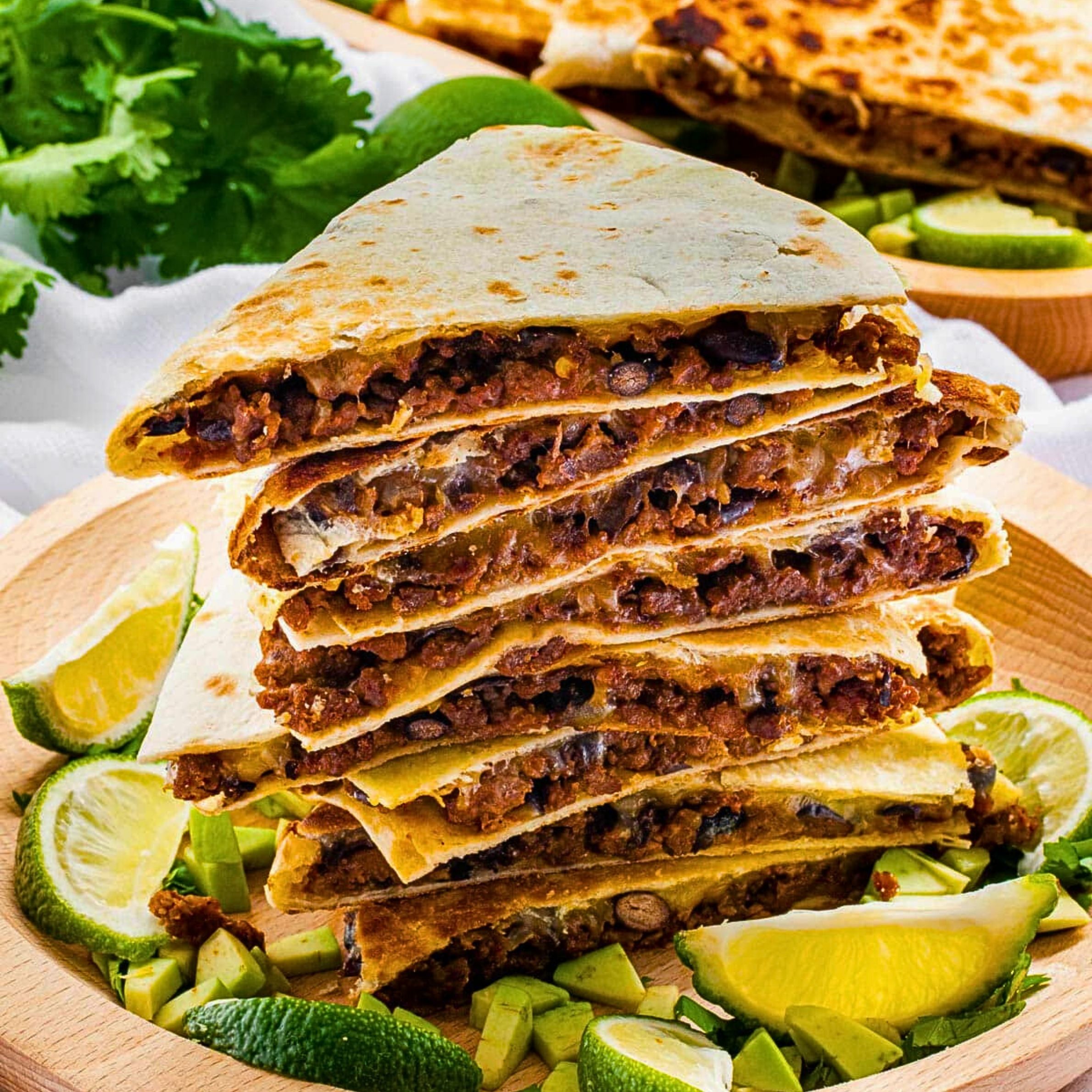 Meat Quesadilla (Flour tortilla w/ melted cheese served w/ onions, cilantro, & green or red salsa. Con carne w/ meat)