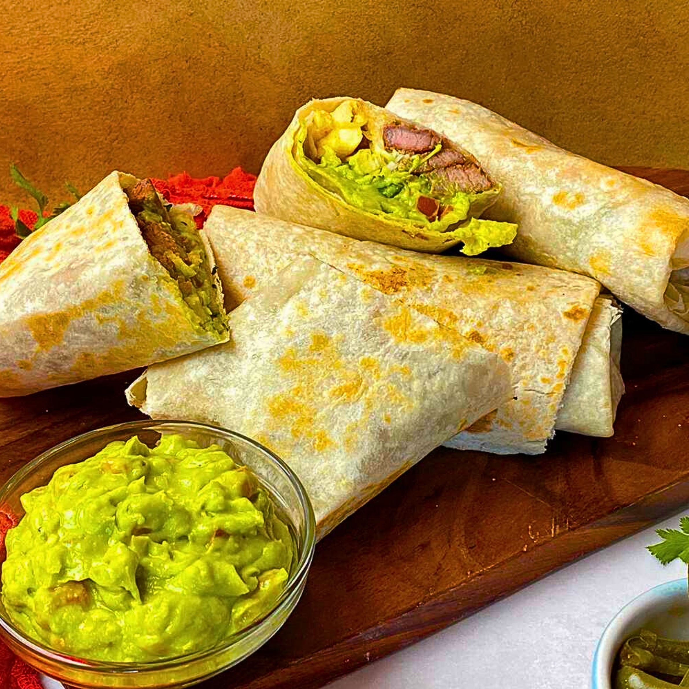 Super Burrito (Asada - Plus sour cream, guacamole and cheese)