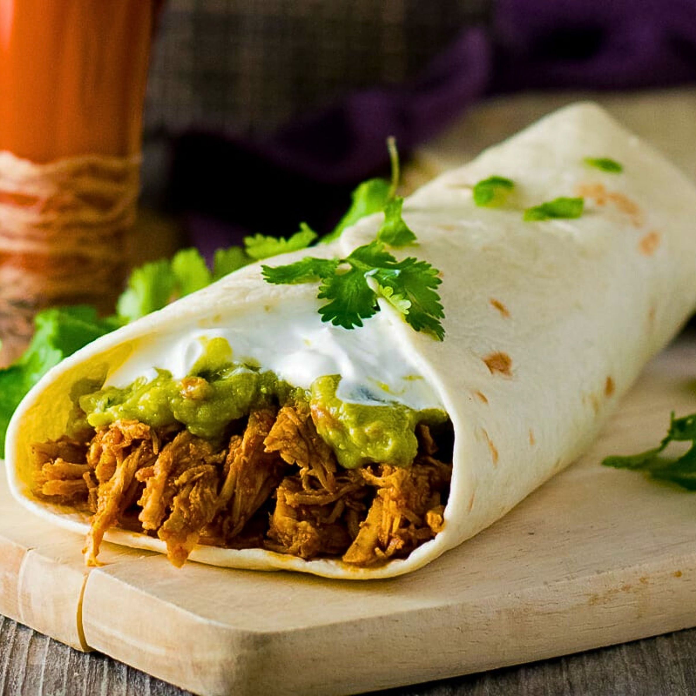 Super Burrito- (Pollo - Plus sour cream, guacamole and cheese)